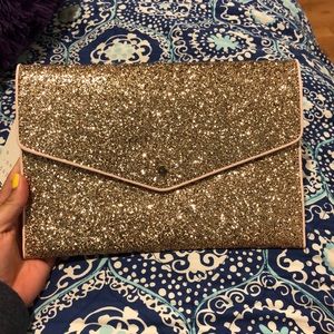 NWT Rose gold handheld clutch